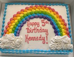 a birthday cake decorated with rainbows and the words happy 5th birthday honeyday on it