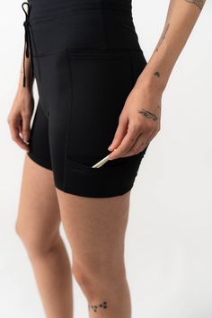 Three pockets, a perfect high-rise, and an elastic band for your glove... these shorts are ready for anything. This product is on Final Sale. Functional Black Bottoms With Built-in Shorts, Black Sports Skort With Built-in Shorts, Black Skort With Built-in Shorts, Black Compression Athletic Shorts With Elastic Waistband, Sports Shorts With Pockets, Knee-length, Functional Black Shorts With Elastic Waistband, Black Shorts With Elastic Waistband, Black Athletic Shorts With Side Pockets For Outdoor, Black Sports Skort Short Length