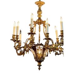 an antique chandelier with five candles