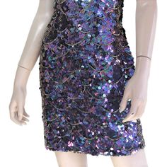 "This 80s-era trophy dress features a fun mermaid scale pattern of iridescent purple sequins and gold beads, a halter neck bodice with open back, and mini length skirt. Perfect for holidays, special occasions, or any time you need to glam it up a bit. Dress is unlined and zips up the back. Best fits size xs or small (please check measurements below). Accessories not included. Payment plans available. Approximate Flat Measurements: Multiply times 2 for bust, waist, and hip measurements. For best Beaded Mermaid, 80s Era, Iridescent Purple, Scale Pattern, Mermaid Scales, Halter Mini Dress, Sequin Beading, Purple Gold, Gold Beads