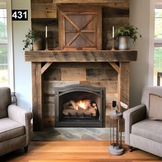 a living room with a fire place and two chairs in front of the fireplace that is made out of wood