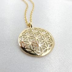 Flower of Life pendant flower of life necklace Seed of Life pendant Gold pendant 14k solid Gold necklace About this Flower of Life pendant: The Flower of Life pendant has a diameter of 0.7 inches (1.8cm) and is crafted in 14 karat solid gold. This beautiful Flower of life pendant is handmade in 14 karat solid gold, with a high vibration and beautiful energy. It's meditative, healing and brings clarity to your life. The gold flower of life pendant recreates the Universe symbol in a delicate piece Flower Of Life Pendant, Universe Symbol, Gem Necklaces, Beautiful Energy, The Flower Of Life, Seed Of Life, Solid Gold Necklace, Golden Jewelry, Gem Necklace