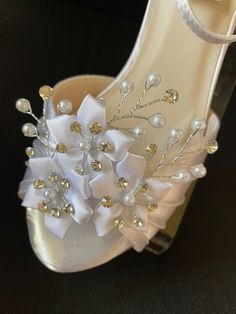 "Low heel shoes 2\" decorated with beautiful satin flower and crystals; Colors: White, Ivory, Off-White. On some pictures crystals look dark, just for extra information, the glass crystals are clear over silver settings, they do bling! FINAL SALE! EVERY SHOES ORDER IS HAND DYED AND/OR EMBELLISHED IN ORDER OF ARRIVAL THEREFORE, SHOES CAN NOT BE RETURNED OR EXCHANGED BECAUSE THEY ARE SPECIALLY FOR YOU; PLEASE CONFIRM YOUR SIZE WITH MEASURING GUIDE IN THE PICTURE, SELLER IS NOT RESPONSIBLE FOR MISC White Flower-shaped Elegant Sandals, White Crystal Embellished Shoe Clips For Wedding, Elegant Floral Embellished Sandals For Weddings, Elegant Floral Embellished Wedding Sandals, White Embellished Heels For Prom, White Crystal Embellished Shoe Clips For Formal Occasions, White Embellished High Heel Wedding Shoes, Embellished White Wedding Shoes For Bridal Shower, Elegant Flower Heels For Wedding