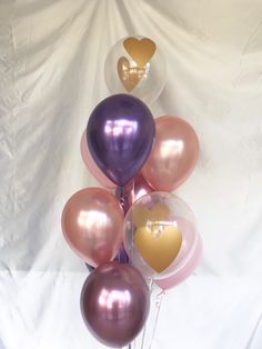 a bunch of balloons with hearts on them