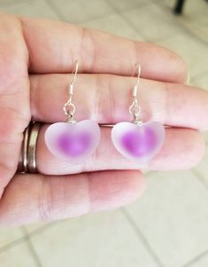 New Purple Frosted Glass Heart Earrings ♡ These beautiful frosted glass puff heart earrings with a purple heart core are sure to get you compliments. ♡ Dangle length measures just under 1.25 inches ♡ .925 sterling silver ear hooks ♡ Lightweight ♡ Ships within 24 hours of purchase Monday-Saturday Cassie Purple Hearts Earrings, Purple Heart-shaped Earrings For Pierced Ears, Purple Heart-shaped Pierced Earrings, Purple Heart Charm Earrings For Valentine's Day, Purple Heart Earrings With Heart Charm, Heart Core, Purple Heart Earrings, Sterling Silver Heart Earrings, Beautiful Anklet