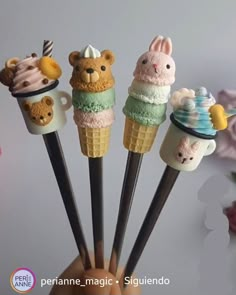 there are five ice cream cones with animals on them