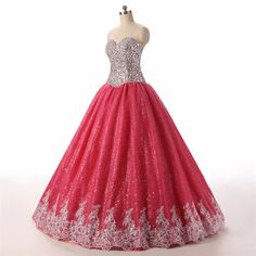 Step into a world of elegance and fantasy with this enchanting Pink Ball Gown. Expertly crafted to capture hearts, the bodice is adorned with exquisite lace and sequins, creating a dazzling effect that glistens with every movement. The back corset detailing not only adds a touch of vintage charm but also ensures a perfect fit that accentuates your natural silhouette.The voluminous skirt flows effortlessly to the floor, embellished with scrolling floral appliqués that add a layer of sophistication and grace. Its intricate pattern work dances in harmony with the rich pink hues, making it ideal for special occasions such as proms, quinceañeras, or formal soirées. The tulle layers create a dramatic, fairy-tale-like volume, allowing you to glide across any room with poise.Designed with comfort Princess Tulle Quinceanera Dress For Gala, Glamorous Embellished Quinceanera Dress For Gala, Princess Style Ball Gown For Gala, Glamorous Lace Bodice Ball Gown For Prom, Glamorous Embellished Dress For Quinceanera, Princess Quinceanera Dress With Sweetheart Neckline For Gala, Elegant Lace Quinceanera Dress For Gala, Glamorous Ball Gown Evening Dress With Lace Bodice, Lace Ball Gown For Prom