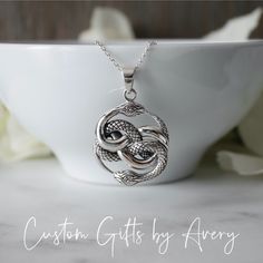 "Inspired from the move \"The Never Ending Story\" this beautiful double ouroboros pendant is cast from .925 sterling silver. The details on the intertwined snakes is incredible. One snake is highly polished with a smooth and the other has carved scales and is oxidized to highlight the details. The detailing and weight of this pendant is impressive.  You have the option to purchase this pendant on its own or with an Italian made sterling silver chain (Box, Rolo, or Snake). The bail opening is ap Double Ouroboros, Snake Ouroboros, Intertwined Snakes, The Never Ending Story, Never Ending Story, Ending Story, Antique Silver Jewelry, White Jewelry Box, Snake Pendant