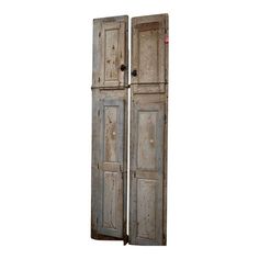 an old pair of wooden doors on a white background