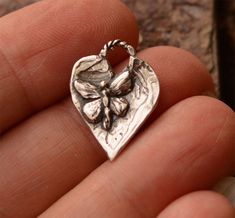 Artisan Handcrafted Butterfly on a Heart. Can be a charm or small pendant. -Measures 18.5mm x 16mm -Overall Height is 21mm tall (includes loop) -Purchase is for ONE -Sterling Silver -Artisan Made in the USA Do you need a jump ring for your charm. If you need me to attach, then choose that option (it is for one of our artisan jump rings that matches your charm). If you are a designer, and need a matching jump ring, this one works great: https://www.etsy.com/cathydailey/listing/859476702/jump-ring Butterfly Earrings Gold, Butterfly Heart, Ormond Beach, Gold Earrings For Women, Precious Metal Clay, Tiny Earrings, Butterfly Jewelry, Funky Jewelry, Gold Butterfly