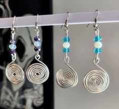 These unique earrings would be a great gift, and are perfect for multiple occasions!  Made with Silver plated Copper wire Spiral Wire Jewelry, Unique Spiral Wrap Earrings For Gift, Unique Spiral Wrap Earrings As Gift, Metal Spiral Earrings With Ear Wire, Spiral Metal Earrings With Ear Wire, Spiral Wire Earrings With Ear Wire, Handmade Spiral Wrap Earrings Gift, Unique Nickel-free Wire Earrings, Wire Wrapped Spiral Earrings In Silver Plated Wire