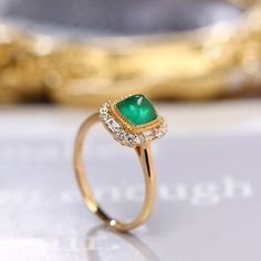 *Condition: Brand new *Center Stone: Natura Emerald from Zambia, approx 0.68ct, 6x6mm (IF clarity, 5A color) *Side Stone: Natural White Diamond, Round Cut & Baguette Cut (VS1 clarity and F color) *Gold Weight: 3.41g (depand the ring size) *Ring Dimension: approx 10x10x8.5mm *Metal Purity: Optional *Each piece is made-to-order with care and special attention to detail. all items are made with conflict-free diamonds and gems. *The item will be gift wrapped and shipped. ------------------------ Yellow Gold Emerald Diamond Ring With Halo Design, Fine Jewelry Yellow Gold Emerald Ring With Halo Design, Exquisite Yellow Gold Diamond Ring With Gemstone, Exquisite Yellow Gold Emerald Diamond Ring, Yellow Gold Emerald Ring With Halo Design, Heirloom Yellow Gold Emerald Ring With Halo Design, Luxury Gold Emerald Ring With Halo Design, Luxury 14k Gold Emerald Ring With Halo Setting, Elegant Emerald Ring With Halo Diamond Design