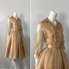 "Vintage Dress This listing is for a wonderful 1950s deadstock vintage dress. This gorgeous golden beauty hails from the New Look Era. This quintessential 1950s's shirtwaist cocktail dress is reminiscent of a simple elegant style that is truly hard to find these days. Its perfect for a formal day party or even a charming day wedding.  This beautiful vintage dress features - 3/4 length sheer chiffon sleeves - matte satin French cuffs - notched collar - 4 buttons - defined waist - full skirt  -chi Vintage Shirtwaist Dress, Bouffant Dress, 50s Prom Dresses, Courthouse Wedding Dress, Fashion 50s, 1950’s Fashion, 50s Fashion Dresses, Dresses 1950s, 1950s Outfits