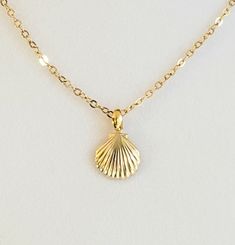 "- Adorable Bright 14K Gold Filled Scallop Shell Pendant or Necklace with 14K Gold Filled Flat Oval Cable Chain and 14K Gold Filled Lobster Clasp. See Photo #1-3. - Scallop Charm measures 5/8 x 1/2\" and is a beautiful yet delicate piece. - Drop Length 5/8\" including the pretty petite Gold Plated Brass Bail. - Chain Length with Clasp 20\". Other Lengths upon request.  - 14K Gold Filled Flat Oval Cable Chain with 14K Gold Filled Lobster Clasp included. See Photo #4.  - This Chain has lots of spa Coquille Saint Jacques, Scallop Shell, Saint Jacques, Gold Flats, Scallop Shells, Shell Pendant, The Pretty, Beautiful Gift Boxes, Photo 1