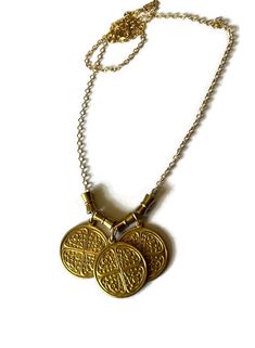 Triple Byzantine Brass Token Necklace with conical bead accents on 14K gold-filled chain.  This is a really unique and fun necklace. Bordering between chunky and simple it is easy to wear with most anything.  Please contact me with any questions. If you require specific measurements, please don't hesitate to ask.  I hope you love your item(s) as much as I loved making it. Please don't hesitate to reach out to me if you have any special requests or alterations. I am happy to make changes to piece Bohemian Gold Charm Necklaces For Good Luck, Bohemian Gold Charm Necklace For Good Luck, Gold Brass Necklaces For Blessing, Gold Nickel-free Charm Necklaces For Good Luck, Gold Nickel-free Charm Necklace For Good Luck, Gold Brass Necklace For Blessing, Gold Brass Necklace For Blessings, Gold Good Luck Charm Necklace Nickel Free, Gold Amulet Charm Necklace Nickel-free