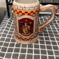 a harry potter mug sitting on top of a table