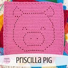 a pink crocheted square on top of a blanket with the words pirscilla pig written across it