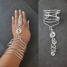 Beautiful wire wrapped harness bracelet made of non-tarnish aluminum wire, is a stunning statement piece. Choose the measurement of your middle finger for your ring size it's usually a size larger than your ring finger. Please come back to visit my shop for new items, and new designs, and lots more to choose from: http://www.etsy.com/shop/SoftlySisterDesigns Wire Wrapped Metal Jewelry For Festival, Wire Wrapped Metal Jewelry For Festivals, Festival Metal Jewelry Wire Wrapped, Festival Wire Wrapped Metal Jewelry, Adjustable Silver Bracelets With Unique Variations, Adjustable Metal Wire Wrapped Jewelry, Silver Adjustable Bracelets With Unique Variations, Adjustable Spiral Wire Wrapped Bracelets, Adjustable Wire Wrapped Cuff Bracelet