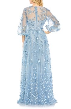 Make a dreamy impression in a blue-hued gown designed with delicate embroidery and gently gathered sheer sleeves. 61" length Hidden back-zip closure Jewel neck Three-quarter sleeves with elastic cuffs Lined 100% polyester Spot clean Imported Asian Owned/Founded Blue Floral Applique Dress For Gala, Blue Floral Embellished Evening Dress For Gala, Blue Floral Embellished Gown For Gala, Blue Floral Embellished Evening Gown, Blue Floral Embroidery Evening Dress, Blue Floral Embellished Floor-length Evening Dress, Blue Floral Embroidered Evening Dress For Spring, Blue Floral Embroidery Evening Dress For Spring, Blue Floor-length Evening Dress With Floral Embroidery