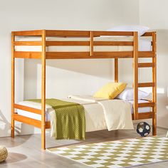 a wooden bunk bed sitting on top of a hard wood floor next to a soccer ball