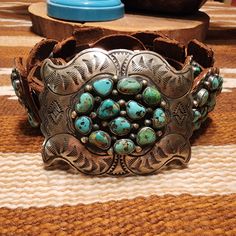 Sterling Silver Turquoise Cluster Belt. New And Never Been Worn. Hallmarked Mr And Stamped Sterling. Buckle Is 3.25 Inches X 3 Inches. Conchos Are 2 Inches X 1.25 Inches And 2.5 Inches X 2 Inches. 13 Leather Backed Conchos Total Plus Buckle. No Holes Have Been Punched In This Belt. Total Belt Length Is 52 Inches. Weight Is 489.34 Grams. Turquoise Belt Buckle, Turquoise Belt, Belt Length, American Jewelry, Native American Jewelry, Silver Turquoise, Turquoise Sterling Silver, Turquoise Jewelry, Belt Buckles