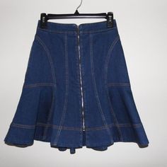 This Is A Stella Mccartney Blue Denim Mini Skirt; Size 38/S. It Is In Like-New Condition, Unworn. It Is A Flared Princess Seamed Design, Zip Front Detail And Mustard Colored Threading. It Has Two Side Pockets And Measures Approx. 20" Long And 27" In Waist. Retro Blue Denim Mini Skirt, Lined Fitted Flared Denim Skirt, Fitted Denim Blue Knee-length Skirt, Vintage Fitted Mini Denim Skirt, Fitted Vintage Mini Denim Skirt, Knee-length Fitted Denim Skirt, Fitted Denim Blue Mini Skirt, Fitted Medium Wash Mini Skirt, Fitted Denim Flared Skirt