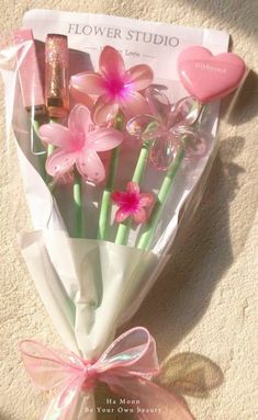 a bouquet of pink flowers in a wrapper