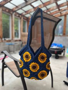 "Handmade sunflower shoulder bag. The Bag is fully lined, keeping it from stretching out of shape and makes sure none of your goodies slip out of the holes. Made with acrylic wool, so it's washable. Perfect as a gift or for yourself. Free Shipping! 34 cm wide x 34 cm (from bottom to base of shoulder strap) 13 1/2\" wide x 13 1/2\" (from bottom to base of shoulder strap) Approximate measurements" Rectangular Bag With Sunflower Print For Everyday Use, Rectangular Everyday Bag With Sunflower Print, Everyday Rectangular Bag With Sunflower Print, Rectangular Sunflower Print Bag For Everyday, Everyday Sunflower Tote Bag, Everyday Sunflower Design Tote Bag, Everyday Rectangular Bag With Sunflower Design, Rectangular Bag With Sunflower Design For Everyday Use, Crochet Sunflower Bag