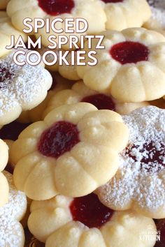 some cookies with jam on them and the words spiced jam spritz cookies