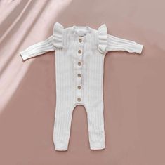 Discover pure adorableness with our Baby Girl Ruffle Knit Jumpsuit, an absolute must-have for your little fashionista! This charming one-piece is crafted with the utmost care, featuring delightful ruffle details that add a touch of sweetness to every wriggle and giggle. Whether it's playtime or a special occasion, our Ruffle Knit Jumpsuit is the perfect choice for capturing those precious moments in style with your little girl. Cold wash and hang dry Knit Baby Romper, Jumpsuit White, Baby Jumpsuit, Knit Jumpsuit, Newborn Outfit, White Jumpsuit, Basic Long Sleeve, Neutral Baby, Precious Moments