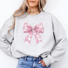 Get in the Halloween spirit with this Coquette Bow Sweatshirt, perfect for those cozy nights in. The design features a festive bow, adding a touch of charm and playfulness to your fall wardrobe. Ideal for Halloween enthusiasts and those who enjoy celebrating the spooky season. Product features - Cozy 50% cotton, 50% polyester blend for colder months - Classic fit with crew neckline for comfort - Durable double-needle stitching for longevity - Ethically grown US cotton with low environmental impact dyes - Festive design perfect for Halloween celebrations Care instructions - Machine wash: cold (max 30C or 90F) - Non-chlorine: bleach as needed - Tumble dry: low heat - Do not iron - Do not dryclean Coquette Sweater, Women's Fall Fashion, Bow Sweatshirt, Halloween Coquette, Cute Coquette, Outfit Cute, Gothic Halloween, Halloween Outfit, Coquette Bow