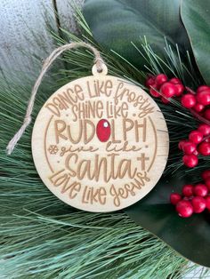 a wooden ornament with the words dance like you're doing rudolphh and santa