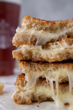 three grilled cheese sandwiches stacked on top of each other