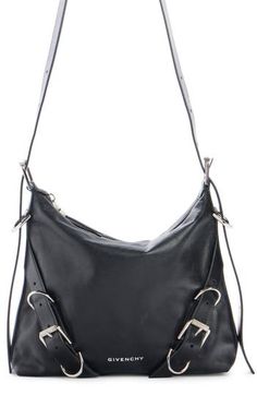 The Voyou style crosses over into a versatile crossbody bag shaped from supple calfskin leather and featuring a buckle-adjustable strap echoed in the detailing. Top zip closure Adjustable strap Leather Made in Italy Crossbody Hobo Bag With Gunmetal Hardware For Evening, Gunmetal Hardware Crossbody Hobo Bag For Evening, Evening Leather Shoulder Bag With Buckle Closure, Travel Crossbody Saddle Bag With Buckle Closure, Travel Saddle Bag With Buckle Closure, Crossbody Style, Leather Satchel Saddle Bag With Buckle Closure, Modern Leather Satchel With Buckle Closure, Leather Saddle Bag With Buckle Closure Satchel, Leather Saddle Bag With Buckle Closure