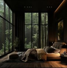 a bedroom with large windows and wooden floors