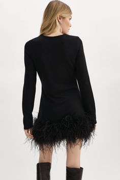 An ode to timeless glamour, the BAHIRA mini dress is made for movement. It features a classic crew neckline and is adorned with wispy ostrich feathers at the hem, designed to turn heads as you make your entrance. Dress it up with classic pumps and delicate earrings. Cocktail Mini Dress With Ostrich Feathers, Black Cocktail Dresses With Ostrich Feathers, Black Ostrich Feather Cocktail Dress, Chic Ostrich Feather Mini Dress For Evening, Evening Mini Dress With Ostrich Feathers, Elegant Ostrich Feather Mini Dress For Night Out, Black Ostrich Feather Dress For Night Out, Elegant Black Ostrich Feather Dress, Chic Ostrich Feather Dress For Night Out