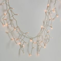 a string of lights is hanging on the wall