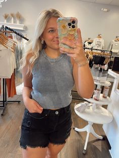 As a product expert, let me introduce you to the Forever Top in Denim. This tank top features a round neckline and sleeveless design for ultimate comfort. Made of 100% cotton, its ribbed, sweater knit and washed pattern adds texture and style while remaining fitted and not lined. Upgrade your wardrobe today! Casual Tank Top With Ribbed Neckline For Layering, Trendy Fall Tank Top For Everyday, Casual Stretch Tank Top With Ribbed Neckline, Trendy Ribbed Tank Top, Trendy Ribbed Tank Top For Everyday, Trendy Everyday Ribbed Tank Top, Casual Summer Sweater Vest For Everyday, Trendy Tank Sweater Vest For Spring, Casual Sleeveless Sweater Vest With Ribbed Neckline