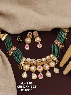 Indian Traditional Jewelry Necklace With Earring, Punjabi Cubic Zirconia Bridal Unique Wedding Set, Minimalist Jewellery Set Gift yourself a royal look with this perfectly crafted kundan necklace set from Manalisstudio. Crafted with high quality kundan stones and pearls, it is impressive in design. The green enamel artwork adds perfect texture to the design. Perfect for weddings and festivities, this antique necklace set should be put on with your favorite sari or lehenga. 100% Satisfaction. Long Lasting Plating, High-Quality Stones. Gifting :- This necklace and earring set comes in a beautiful manalisstudio gift box, making it an ideal gift for birthdays, weddings or anniversaries. Occasion :- Perfect choice for any Indian occasion. Care :- It is advisable that you keep Manalis products a Punjabi Jewelry Traditional Necklace, Unique Wedding Sets, Antique Necklace Set, Minimalist Jewellery, Kundan Necklace, Kundan Necklaces, Antique Necklace, Indian Traditional, Wedding Jewellery Necklace