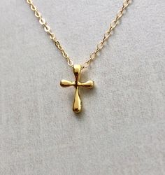 Pretty gold vermeil cross pendant hangs on a 14k gold fill chain. Pendant is 1/2ths of an inch in length. If you want a chain shorter than 16 inches, just mention your preference when you checkout. Item comes packaged in a little jewelry box. 14k Gold Filled Cross Jewelry Gift, Gold Cross Necklace With Delicate Chain For Everyday, Everyday Gold Cross Necklace With Delicate Chain, Everyday 14k Gold Cross Pendant Necklace, Everyday 14k Gold Cross Necklace, Daily 14k Gold Cross Pendant Necklace, Spiritual Tarnish-resistant Cross Necklace As Gift, Gold Cross Necklace For Gift, Gold Spiritual Cross Necklace Tarnish Resistant