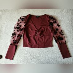 Burgundy Blouse. Size: Medium. (Material Has A Little Stretch To It) No Tears. No Stains. Smoke-Free Home Removed Tags But Never Used. Flowers Detailed On Sleeves. Selling It In Dark Green As Well. Fall V-neck Top With Sheer Sleeves, Fall Date Night Tops With Sheer Sleeves, Chic Burgundy V-neck Blouse, Chic Burgundy Tops For Party, Elegant Stretch Burgundy Tops, Chic Burgundy Party Top, Sheer Sleeve V-neck Top For Night Out, Burgundy V-neck Top For Date Night, Burgundy Blouse For Spring Party