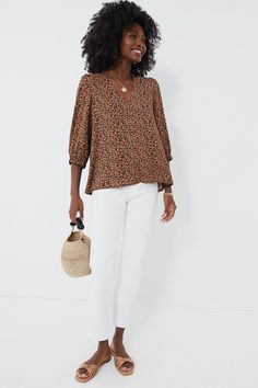 Leopard is back and we are obsessed with the Hollis Top! Featuring a playful print, V-neckline, and slightly puffed sleeves, this polished number is perfect for an elevated daytime look or for cocktail hour. We are pairing it with denim and sandals for an effortlessly chic throw-on-and-go look. V-neckline Three-quarter length sleeves Elastic cuffs Longer back Relaxed fit Material: 100% Polyester Care: Hand wash cold, hang to dry. Do not bleach, do not iron. Fall V-neck Puff Sleeve Top For Work, Chic Printed Blouse With Balloon Sleeves, Chic Floral Print Puff Sleeve Top For Fall, Chic Floral Puff Sleeve Top For Fall, Chic Puff Sleeve Top With Floral Print For Fall, Chic Puff Sleeve Top With Floral Print, Fall V-neck Puff Sleeve Top, Summer V-neck Puff Sleeve Top With Blouson Sleeves, Trendy V-neck Puff Sleeve Top For Spring