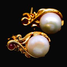 Gorgeous Natural White Pearl Art Nouveau Estate Earrings Each earring features a natural creamy white 9mm pearl in an elegant art nouveau setting, topped with a tiny red ruby! They have pushback closures for pierced ears.  The setting is lustrous 18k yellow gold over sterling silver.  Each earring measures 11.3 x 17.3 mm. Although vintage, from an estate, these earrings are in excellent condition. They would make a great gift OR a wonderful addition to your personal collection!  They will come t White Cabochon Earrings For Anniversary, Classic Pearl Gemstone Earrings As Gift, Classic Pearl Earrings With Gemstone For Gift, Classic Gold Pearl Earrings With Gemstone, Gift White Hallmarked Pearl Earrings, Ears Art, Red Ruby Earrings, Pearl Art, Ear Art