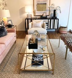 a living room with two couches and a coffee table in the middle of it