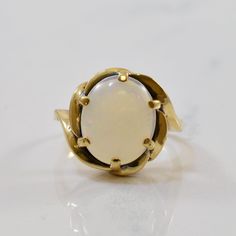 Metal | 10k Yellow Gold  ---|---  Size | 2 3/4  Width | 1.35mm  Gemstone | Oval Cut Opal  Carat | 1.40ct Opal Solitaire Ring, Solitaire Ring, Oval Cut, Gold Bracelet, Opal, Size 2, Wedding Rings, Yellow Gold, Engagement Rings