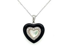 PRODUCT DESCRIPTION: 14k White Gold Dainty Heart Pendant Necklace With Diamond Outline / Black Onyx Outline / & Mother of Pearl Center / Elegant 14k Heart Gift - Solid 14k White Gold: 2.55 Grams - 18 Natural Diamonds / Total Weight: .16 Carats - High Quality Diamonds: (F-G Color / VS Clarity) - Black Onyx  - Mother of Pearl  - Pendant Dimensions: (16mm Height) x (16mm Width) - Chain Details: Solid 14k White Gold Cable Chain With Lobster Lock (Approx 1mm Chain Width)  ---------------------------- Black Heart-shaped Jewelry For Anniversary, Black Necklace For Anniversary On Valentine's Day, Black Necklaces For Anniversary On Valentine's Day, Black Heart Pendant Jewelry For Formal Occasions, Valentine's Day Black Necklace For Anniversary, Black Double Heart Jewelry For Anniversary, Elegant Black Open Heart Necklace, Elegant Black Necklace With Heart Charm, Elegant Black Double Heart Necklace