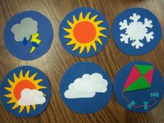 paper cut outs with different weather symbols on them