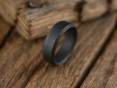 About This Ring The Singularity ring is constructed from solid grade 5 titanium for the ultimate in lightweight performance, then given an awesome matte black finish. Perfect for those who don't like traditional polished finishes! Free shipping in the USA! Every Richter Scale ring is covered by our 100% Guarantee Details Resizing This ring can be resized UP ONLY as much as 1 full size Materials Titanium Finish Matte Black Care instructions Clean with mild soap and water as needed. Fit Comfort fi Richter Scale, The Singularity, Black Titanium Ring, Wedding 2025, Titanium Ring, Black Plain, Plain Bands, Grade 5, Titanium Rings