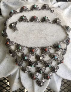 Circa 1800s Beautiful Art Nouveau Austro Hungarian Sterling Silver Coral Persian Turquoise Mother of Pearl Antique Festoon Bib Necklace See matching earrings in link below https://www.etsy.com/listing/693901515/circa-1800s-beautiful-art-nouveau-austro?ref=shop_home_active_1&frs=1 Traditional Jewelry With Historical Design For Collectors, Vintage Multi-stone Ceremonial Jewelry, Ornate Multicolor Jewelry With Intricate Design, Vintage Multi-stone Jewelry For Ceremonial Occasion, Ornate Multi-stone Jewelry For Ceremonial Occasions, Elegant Multicolor Filigree Jewelry, Victorian Multicolor Formal Jewelry, Multicolor Victorian Jewelry For Formal Occasions, Ornate Turquoise Jewelry For Collectors