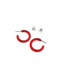 A transparent red lucite hoop earring in a small and narrow size & shape. This is the skinny Tube Hoop & measures about 1" or 25mm in diameter & only 3.5mm in diameter. Super light weight & they go with anything. The look is modern, sleek, and minimalist or can be rocked with any retro inspired style as well. The most versatile earrings we stock. Earrings are made with vintage lucite parts that were made in the US or Europe in the 1960's - early. We hand-set them with surgical steel earring post Trendy Red Hoop Earrings, Modern Red Small Hoop Earrings, Modern Small Red Hoop Earrings, Trendy Small Red Hoop Earrings, Trendy Small Hoop Red Earrings, Trendy Red Plastic Jewelry, Small Red Hypoallergenic Hoop Earrings, Red Small Hoop Earrings, Trendy Red Hoop Earrings For Everyday